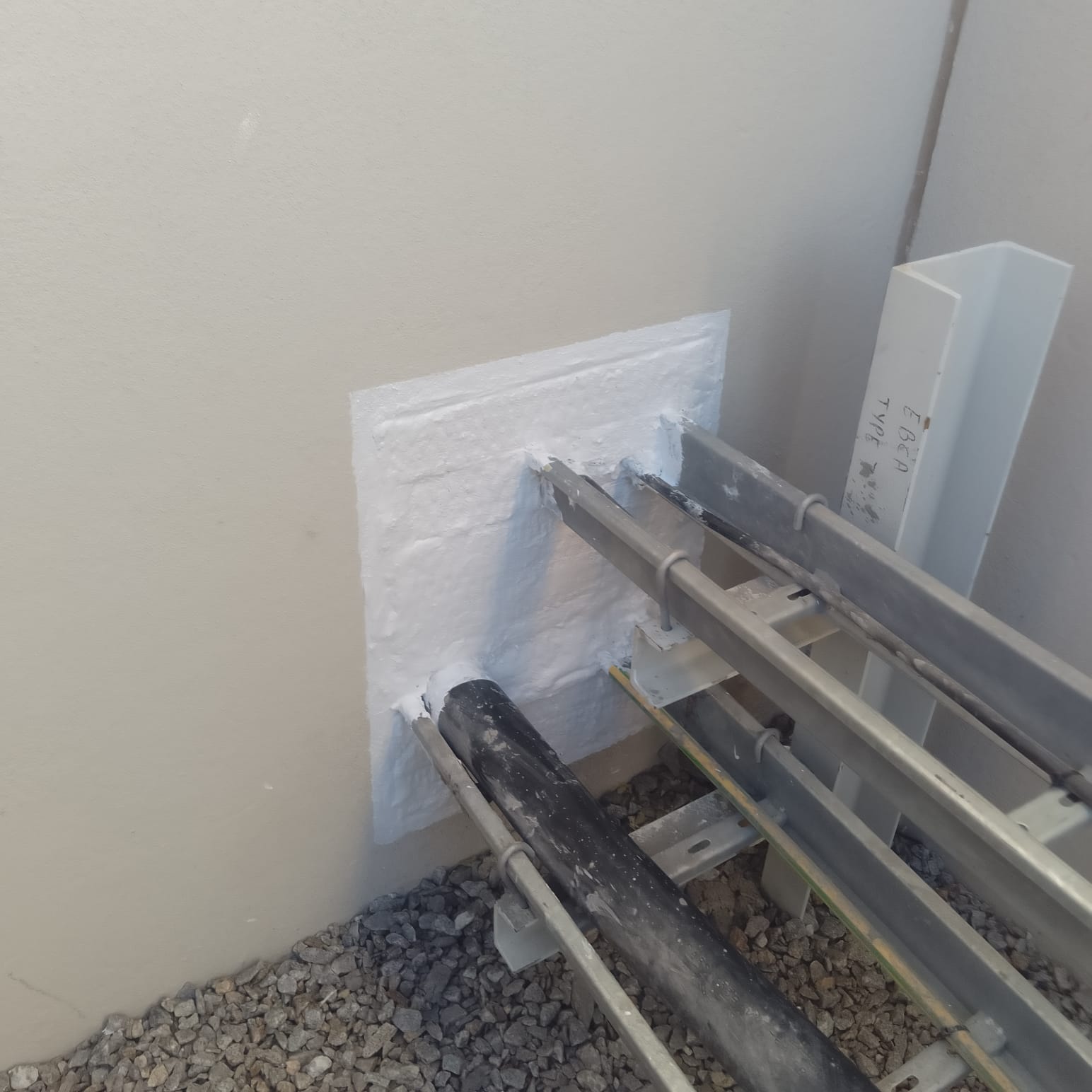 Sealed steel reinforcement penetration on a construction site